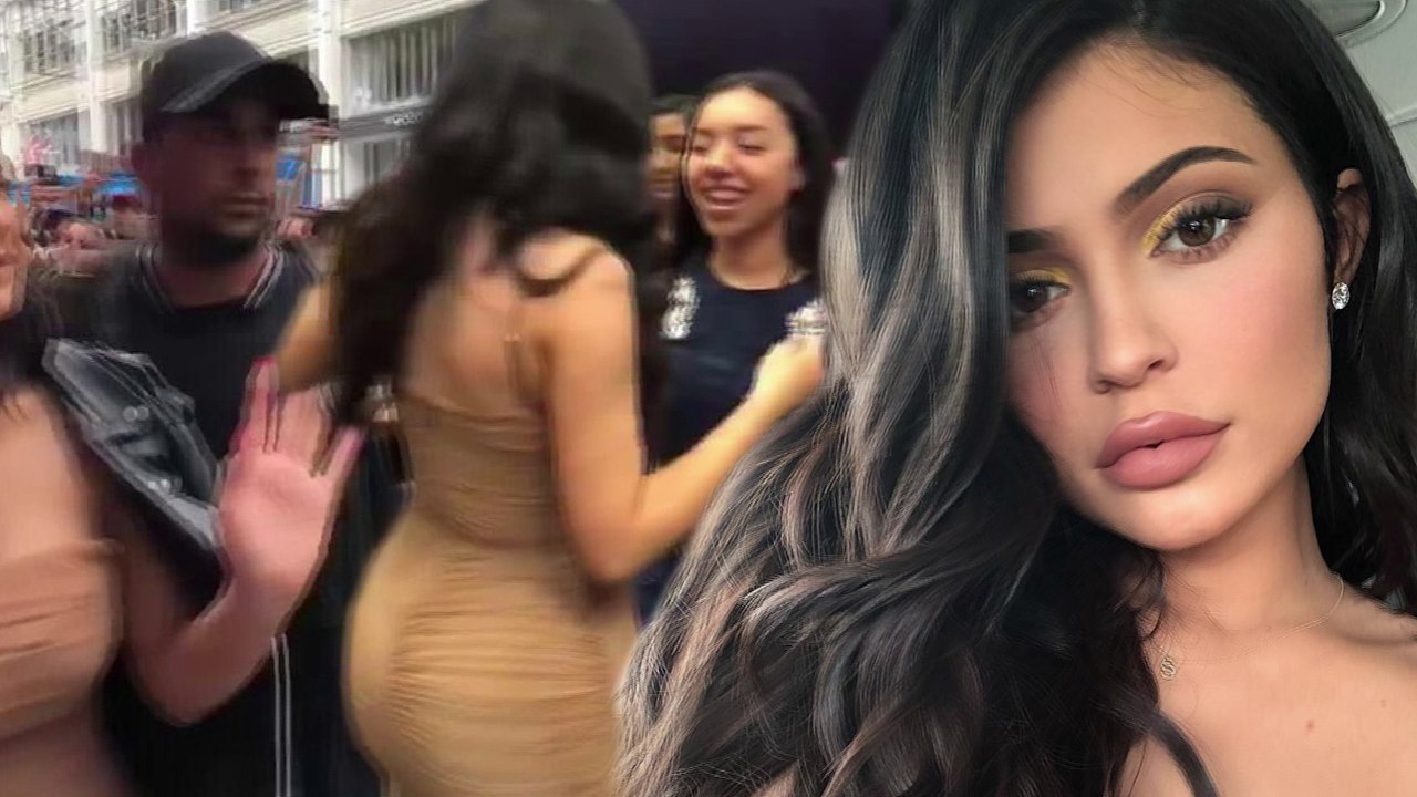 Kylie Jenner flashes the flesh in low cut cream dress as she greets fans at pop up make-up store