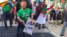 متظاهرة فرنسية تضرب صورة نتنياهو وتبصق عليها خلال متظاهرة في باريس احتجاجًا على مجزرة غزة، بمشاركة متضامنين مع فلسطينيين ومهاجرين عرب.