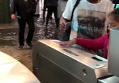 Commuters Walk Through Flooded Metro Station in Paris