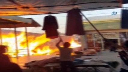 Esnaf mallarını son anda kaçırdı... Tekel bayisine sıçrayan alevler mahalleyi yakıyordu