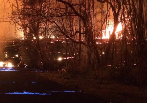 Blue Flames Emerge Between Road Cracks During Kilauea Volcano Eruption