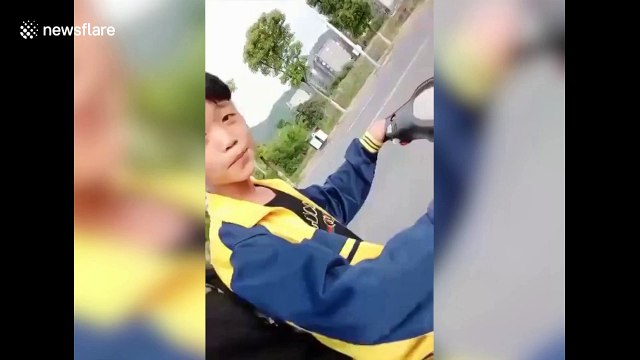 Chinese boys film sickening scooter crash while taking selfies