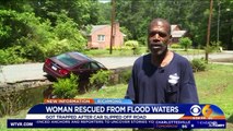 Man Rescues Woman from Car Stalled in Flood Water