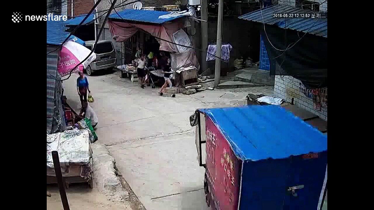 Three-wheeler started up by 9-year-old girl crashes into stall, tips over and flattens boy