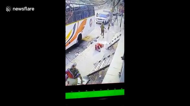 Terrifying moment armed man robs woman on busy road