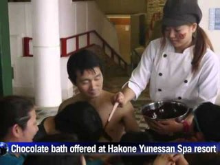 AFP: Visitors take a dip in chocolate spa in Japan