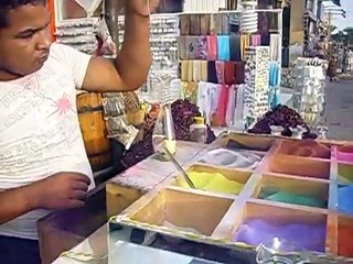 Painting by colored sand in a glass bottle.. Awsome!