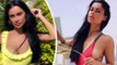 Cally Jane Beech channels Baywatch in eye-popping red swimsuit before posing for sweet snap with baby Vienna in matching outfits