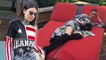 Kendall Jenner flaunts impossibly long legs in thigh-high boots while lounging atop the city skyline