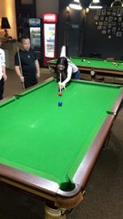 the girl performed billiards, the two men looked admiringly