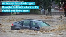 Floodwaters Rage Through The Streets Of Maryland Town
