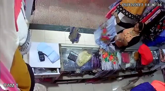 Well dressed Indian girl's theft caught on CCTV camera inside a textile shop...!!!!