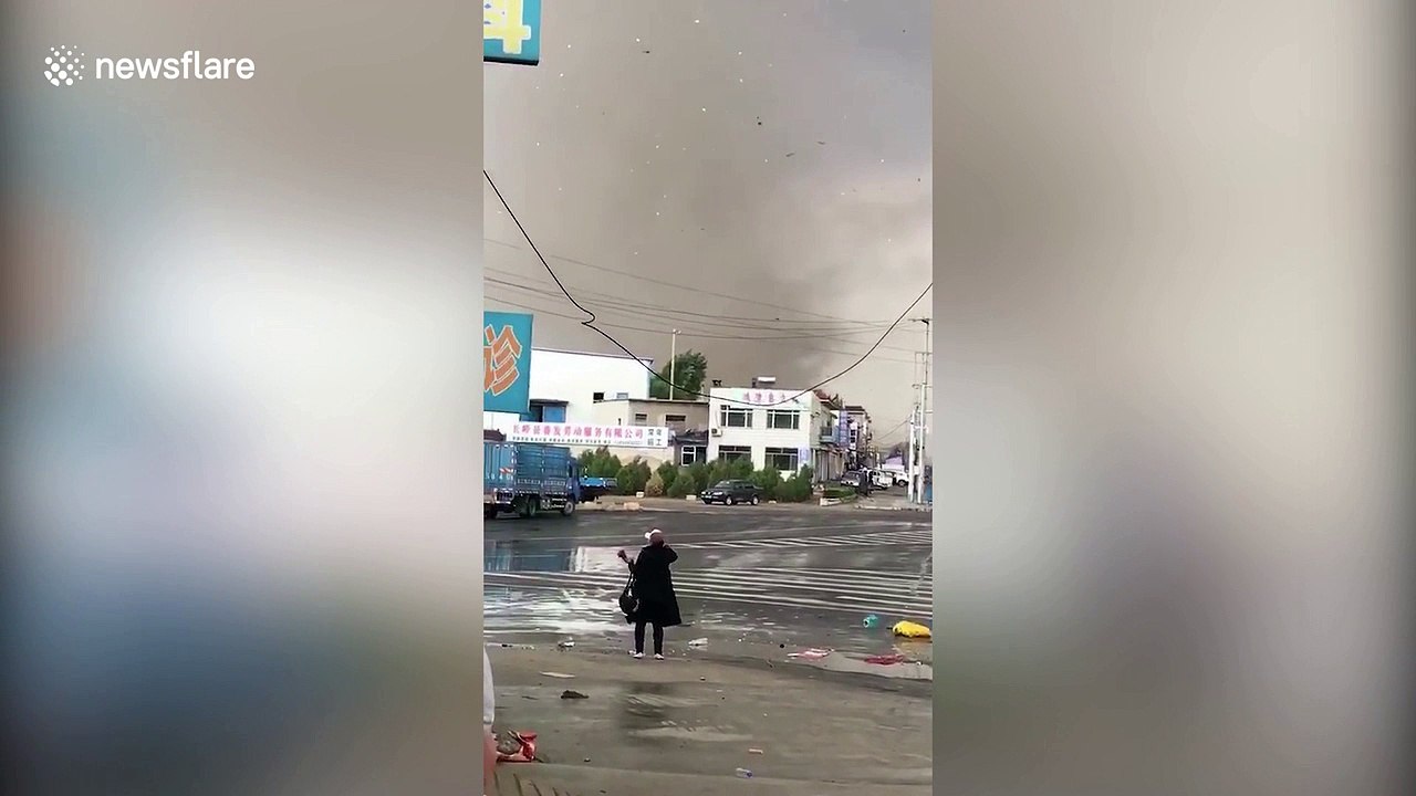 China tornado rips roofs from houses