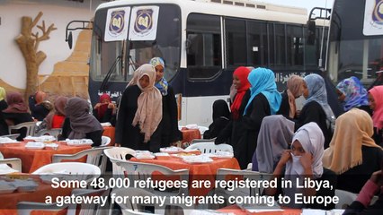 Muslim migrants break their fast in the Libyan capital