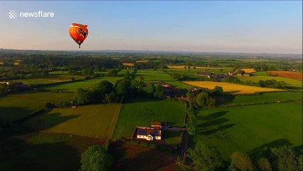 Drone camera captures hot air balloons at sunset