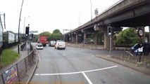 Dashcam captures moment when truck overturns as it passes underneath bridge