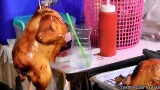 Thailand Street Food. Roasted Chicken in Charcoal Oven. Bangkok