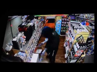 Shop workers use sweets to fight of robber with an axe