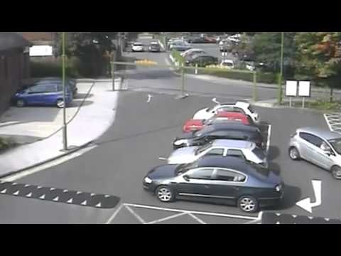 Driver smashes into two parked cars as it reverses from a parking spot