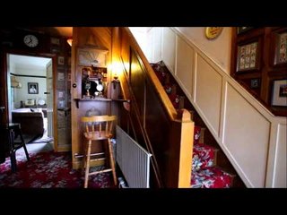 Man builds 1930's style bar under his stairs