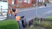 CCTV of Bin Man Taking Rubbish Out Of Bin And Dropping It Onto Street