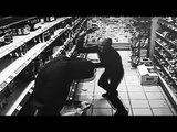 Shopkeeper fights off thief with champagne bottle