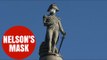 Greenpeace activists put mask on Nelson atop his column in Trafalgar square protest