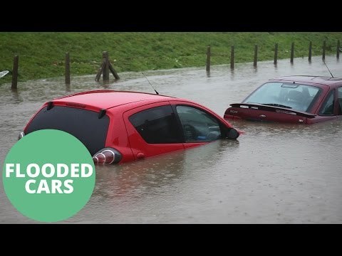 Flooding Caused By Heavy Rain Has Risen To Chest Hight Submerging Cars