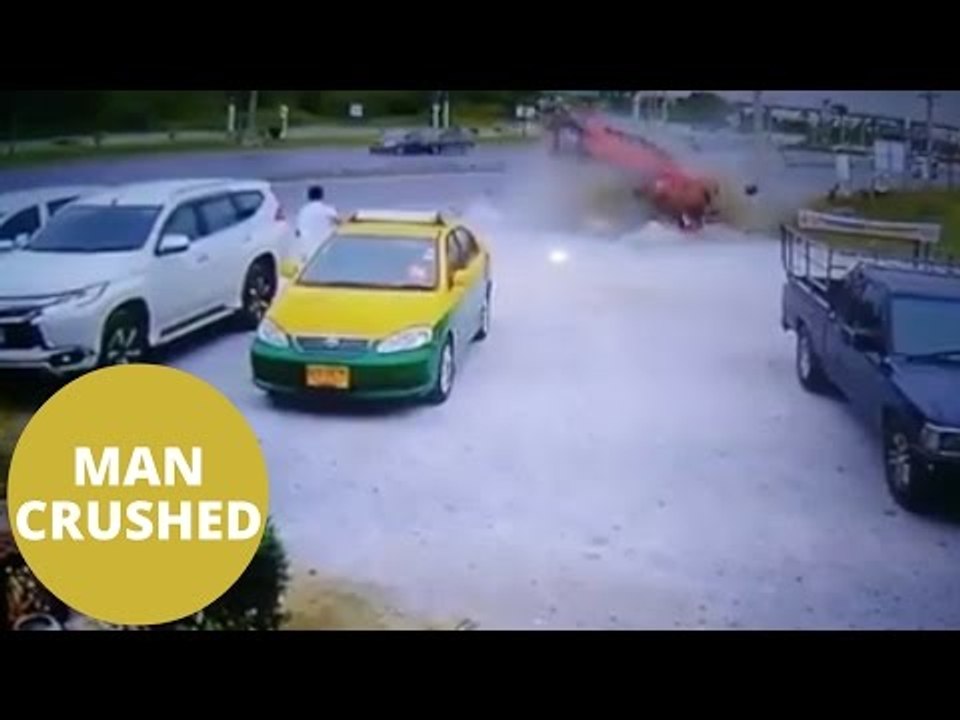 The horrific moment a taxi driver is crushed by an out of control car