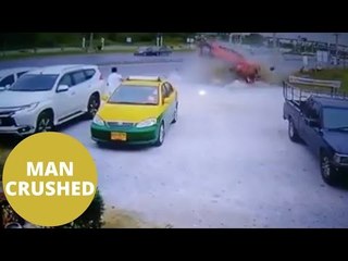 The horrific moment a taxi driver is crushed by an out of control car