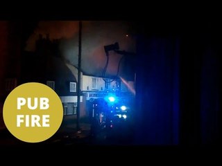 Two children and an adult rescued from a devastating fire which consumed a 150 year old pub