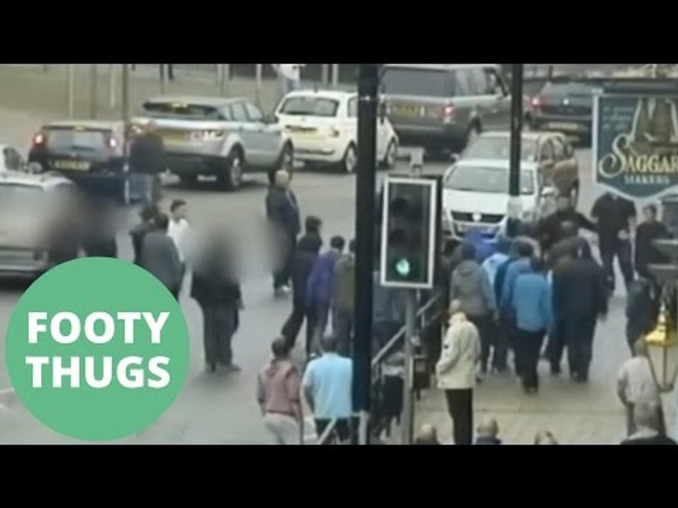 Football thugs caught on CCTV rioting 'like pack of animals'