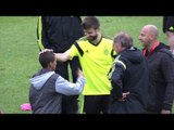 World Cup 2014 - Gerard Pique Gives His Tracksuit Top To Young Pitch Invader