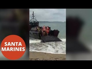 Marines Dressed As Santa And Jesus Arrive On Cornish Beach On Boat