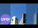 This spooky footage has gone viral after appearing to showing two UFOs hovering over a city.