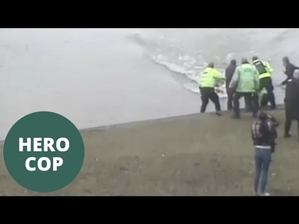 Hero cop dive into freezing water to save drowning man from river