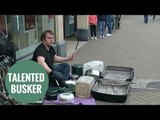 Amazing busker who plays the drums with old kitchen utensils.