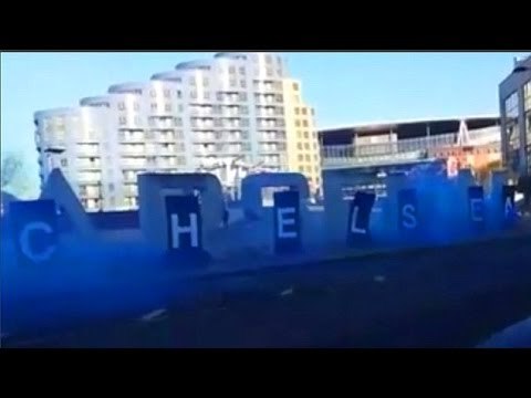 Chelsea Fans Cover Arsenal Sign At The Emirates & Let Off Blue Smoke Bombs