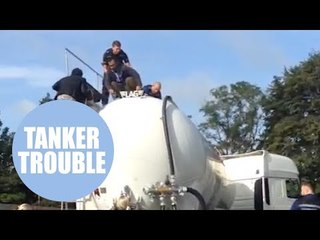 Moment a group of alleged "illegal immigrants" were pulled from inside a TANKER