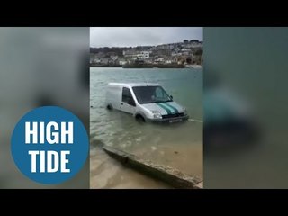 A community come together to rescue van stuck in harbour