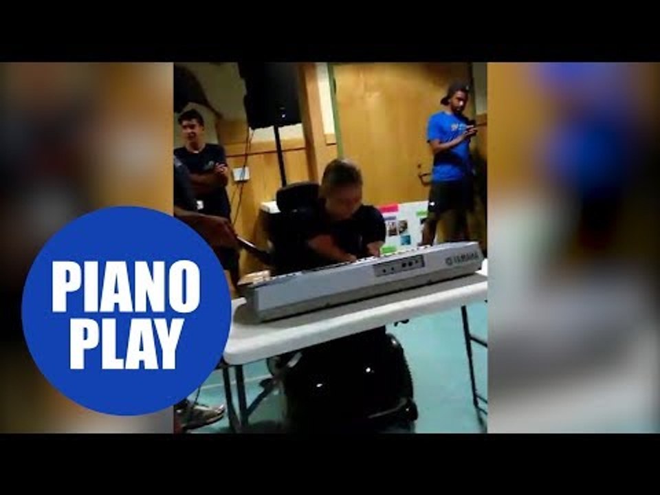 Girl with no arms and legs plays piano in front of a crowd in this emotional clip