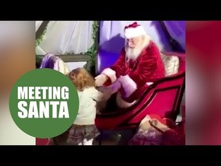A little girl took her first steps unaided - to see Santa in his grotto