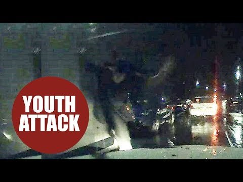 Thugs smashing up taxi with metal poles in shocking road rage attack
