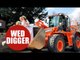 A JCB driver and his new bride ride in bucket of big digger on their wedding day