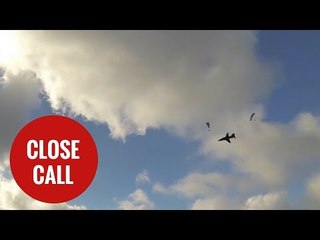 Royal Navy Hawk narrowly misses paragliders