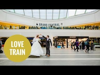 Newlywed couple pose for their marriage photos at train station