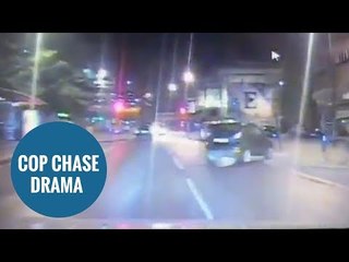 police pursuing stolen car through city centre during high speed chase