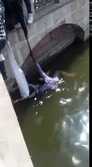 People trying to save a girl and Man from Water...!!!Stunning Live footage...!!!