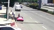 Woman pulled over for driving pink bumper car on busy street