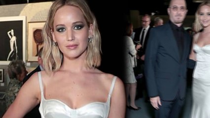Jennifer Lawrence smolders in white silk while crossing paths with ex Darren Aronofsky at BAM Gala